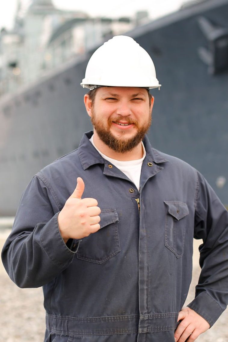 worker giving thumbs up sign